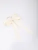 Large Cream Bow Hair Tie sold by lovisa