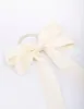 Large Cream Bow Hair Tie sold by lovisa