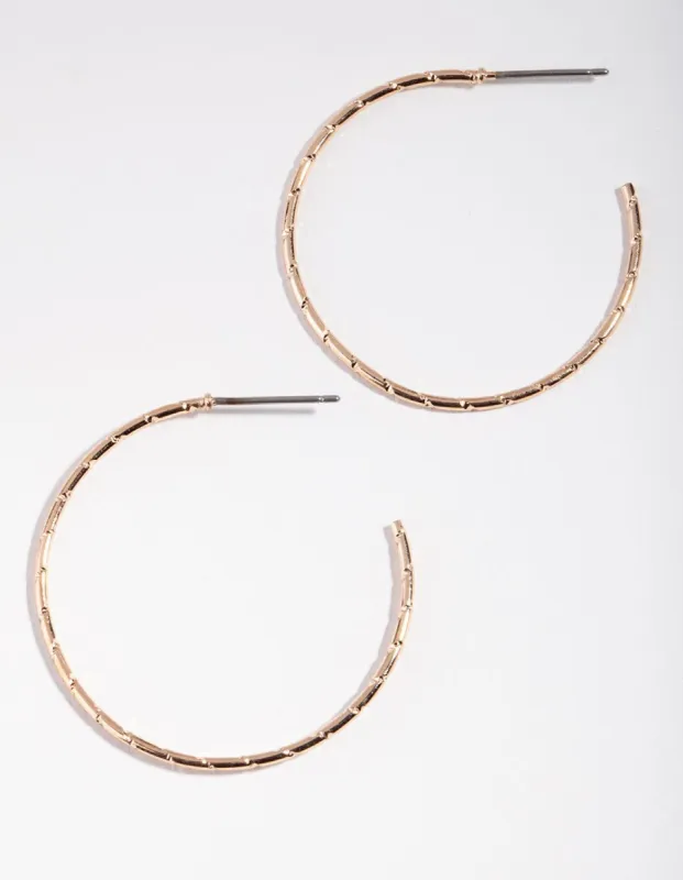 Gold Fine Medium Textured Hoop Earrings sold by lovisa