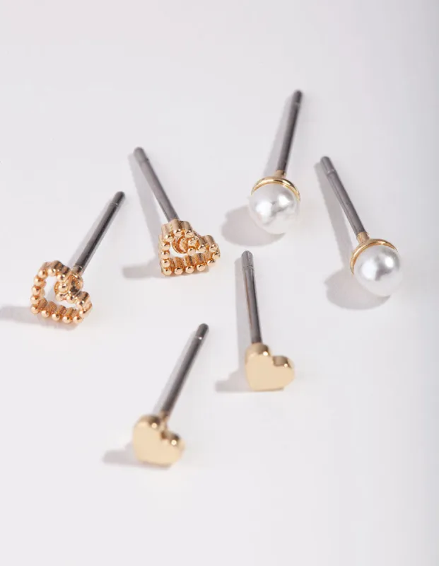 Gold Heart & Pearl Earrings sold by lovisa