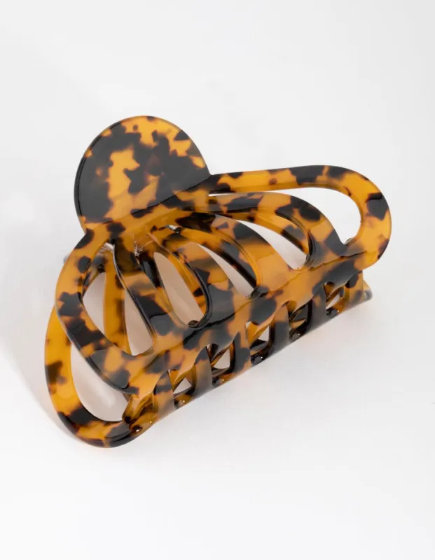 Tortoiseshell Round Cut Out Claw sold by lovisa