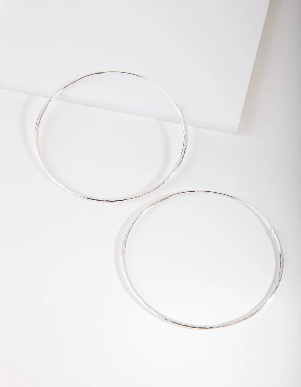 Sterling Silver Hammered Hoop Earrings sold by lovisa