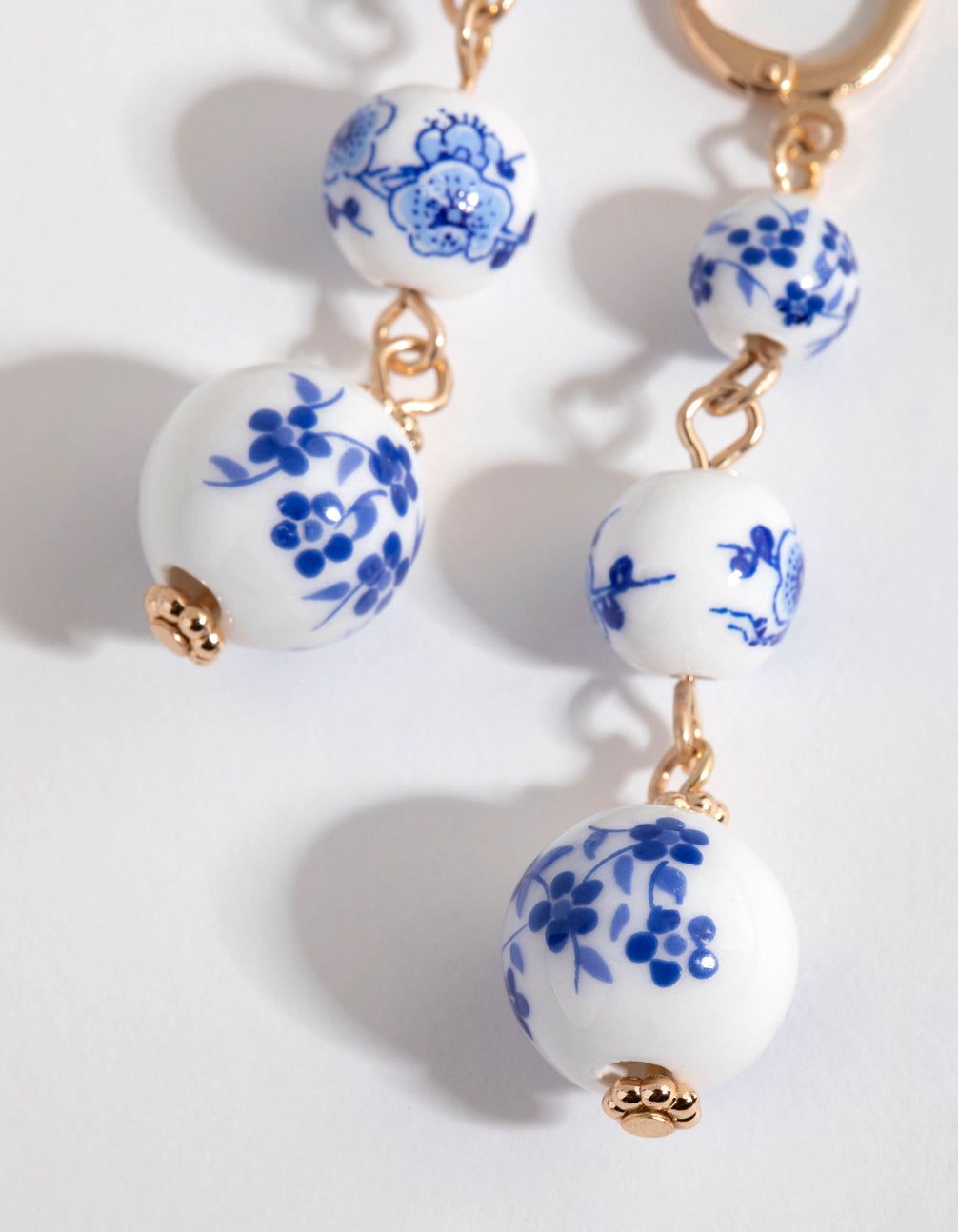 Gold Triple Bead Huggie Earrings sold by lovisa product image thumbnail 2