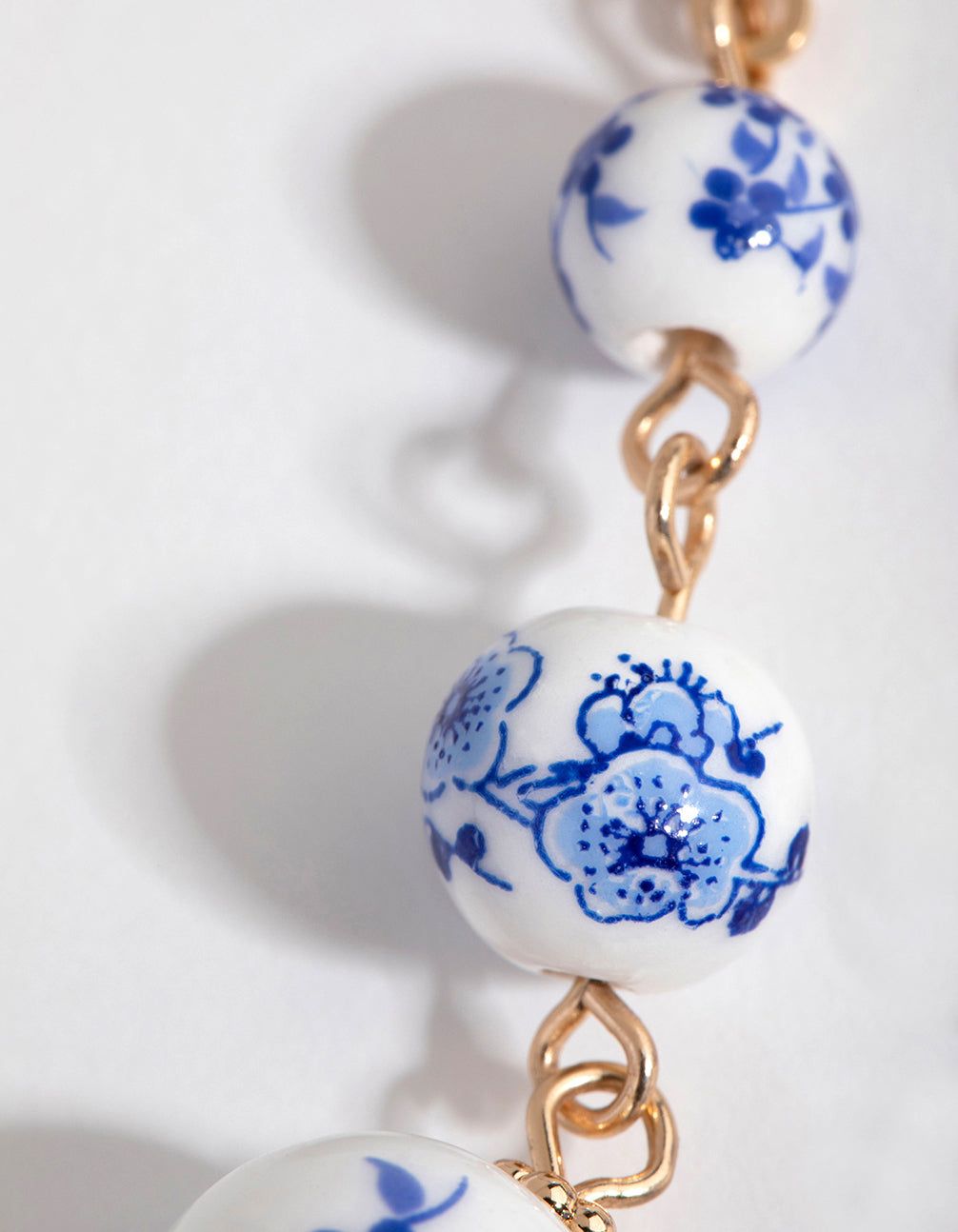 Gold Triple Bead Huggie Earrings sold by lovisa product image thumbnail 3