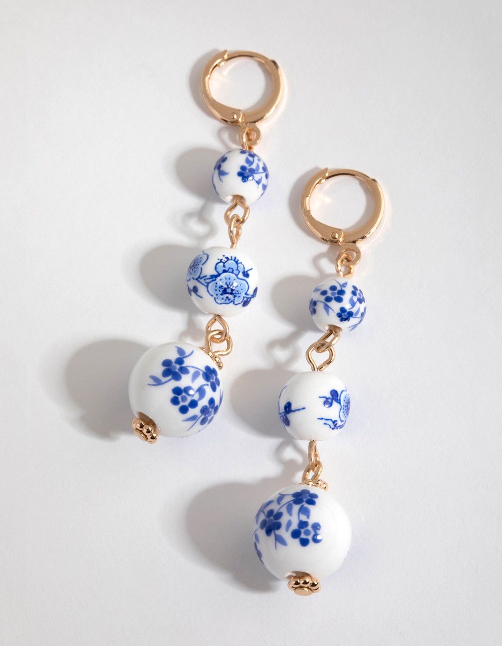 Gold Triple Bead Huggie Earrings sold by lovisa