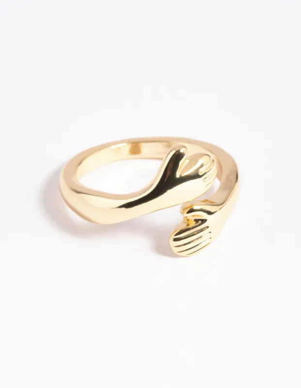 Gold Plated Hugging Hands Ring sold by lovisa