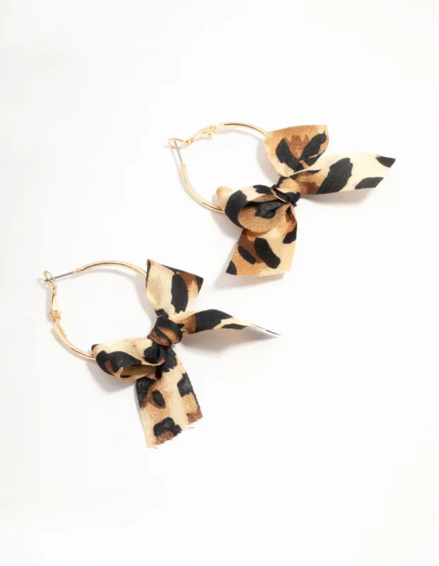 Cheetah Bow Fabric Hoop Earrings sold by lovisa