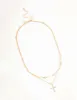 Gold Layered Diamante Cross & Pearl Necklace sold by lovisa
