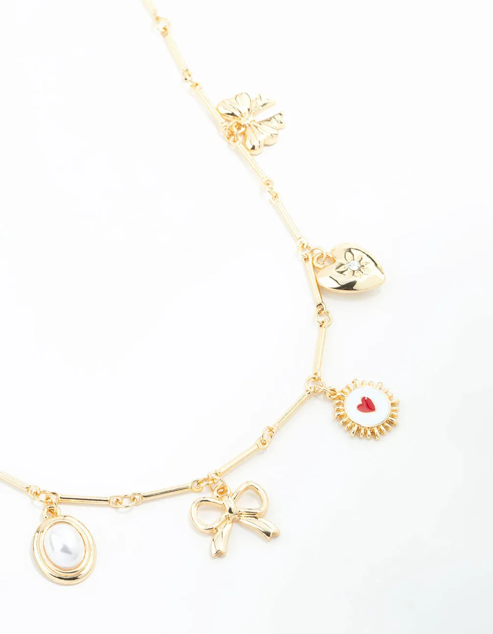 Gold Plated Heart & Bow Charm Necklace sold by lovisa