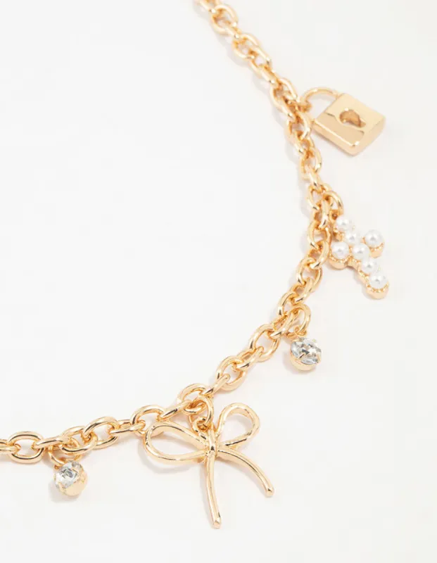 Gold Bow & Cross Charm Necklace sold by lovisa