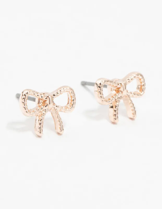 Rose Gold Twisted Bow Stud Earrings sold by lovisa