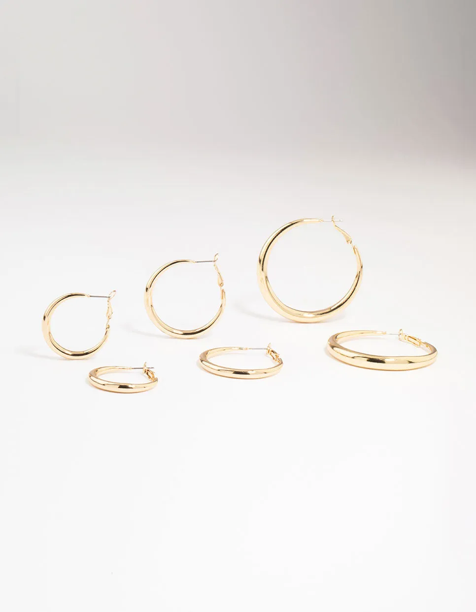 Gold Smooth Huggie Hoop Earrings 3-Pack sold by lovisa
