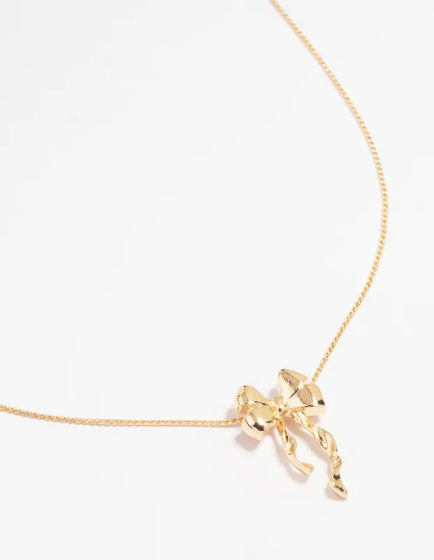 Gold Bow Twirl Pendant Necklace sold by lovisa