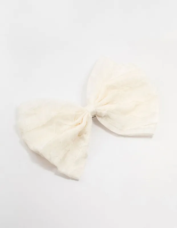 Small Cream Ruffle Fabric Bow Clip sold by lovisa