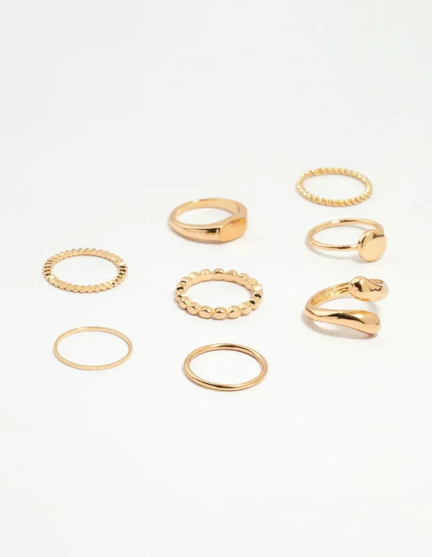 Gold Thin Wrap Circle Stacking Rings 8-Pack sold by lovisa