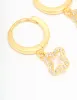 Gold Plated Sterling Silver Cubic Zirconia Flower Huggie Earrings sold by lovisa