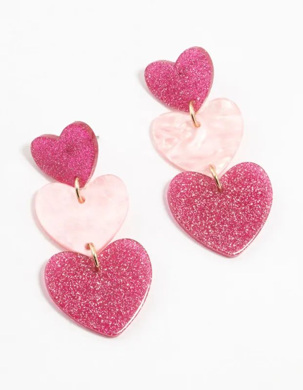 Triple Pink Acrylic Glitter Heart Drop Earrings sold by lovisa