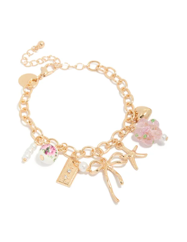 Gold Flower Bow & Star Charm Bracelet made by lovisa