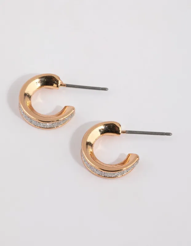Gold Glitter Huggie Earrings sold by lovisa