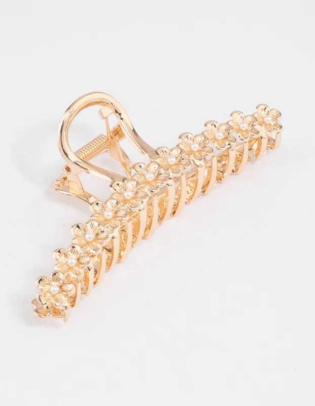 Gold Pearl & Flower Claw Clip sold by lovisa