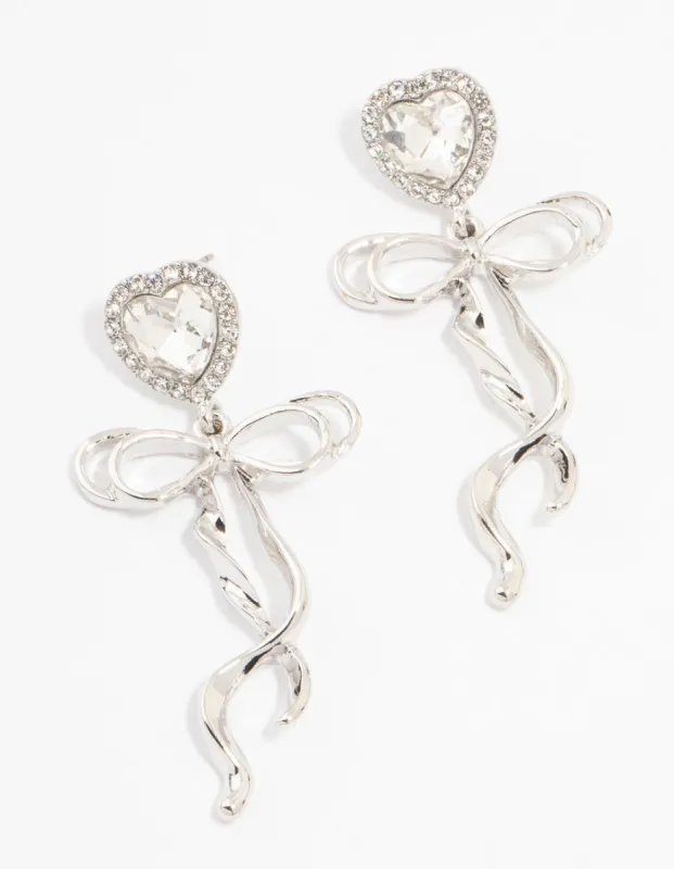 Rhodium Diamante Heart Bow Drop Earrings sold by lovisa