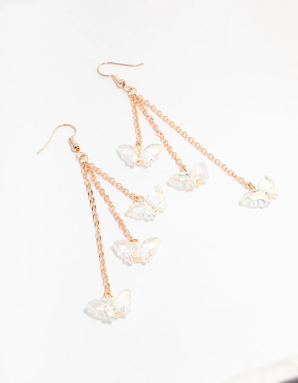 Rose Gold 3 Row Plastic Butterfly Drop Earrings sold by lovisa