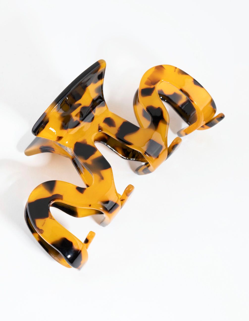 Tortoiseshell Acrylic Swirl Claw sold by lovisa