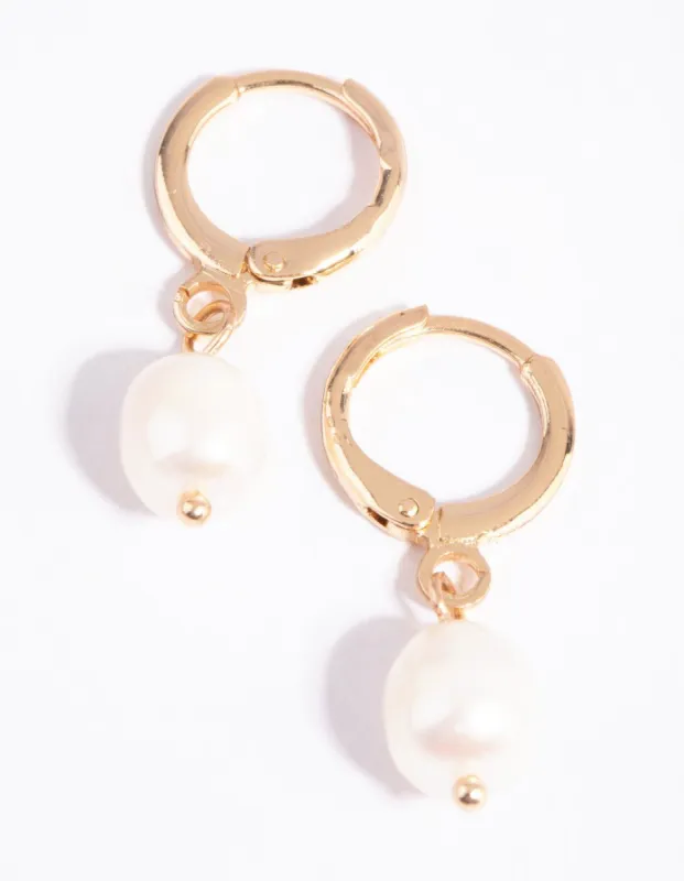 Gold Pearl Huggie Earrings sold by lovisa