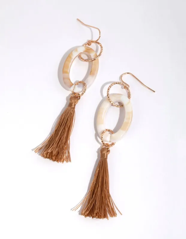 Gold Acrylic Oval & Tassel Drop Earrings sold by lovisa