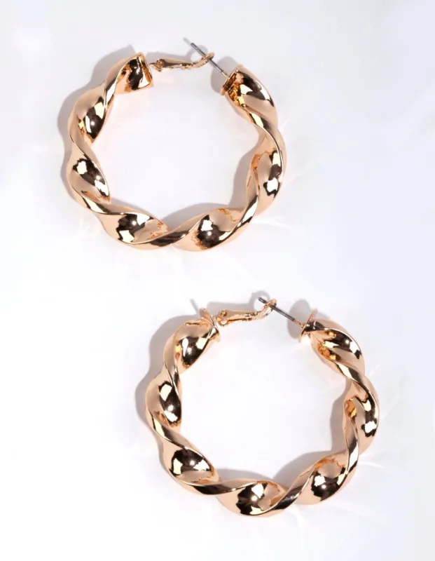 Gold Twisted Hoop Earrings sold by lovisa