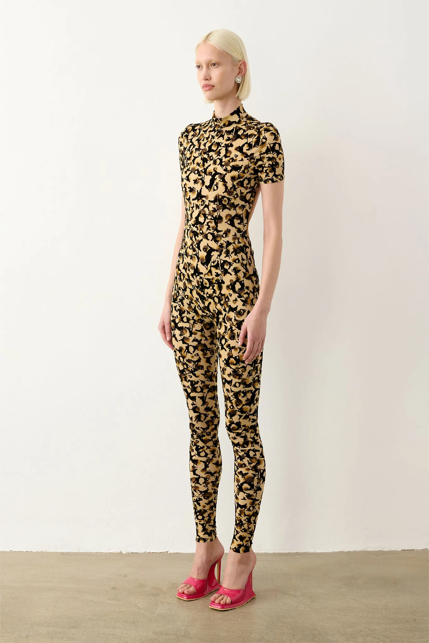 knockout dress with adult themed pattern in beige leopard print Jessica Bara Chirah High Neck Halter Leopard Print Backless Maxi Dress