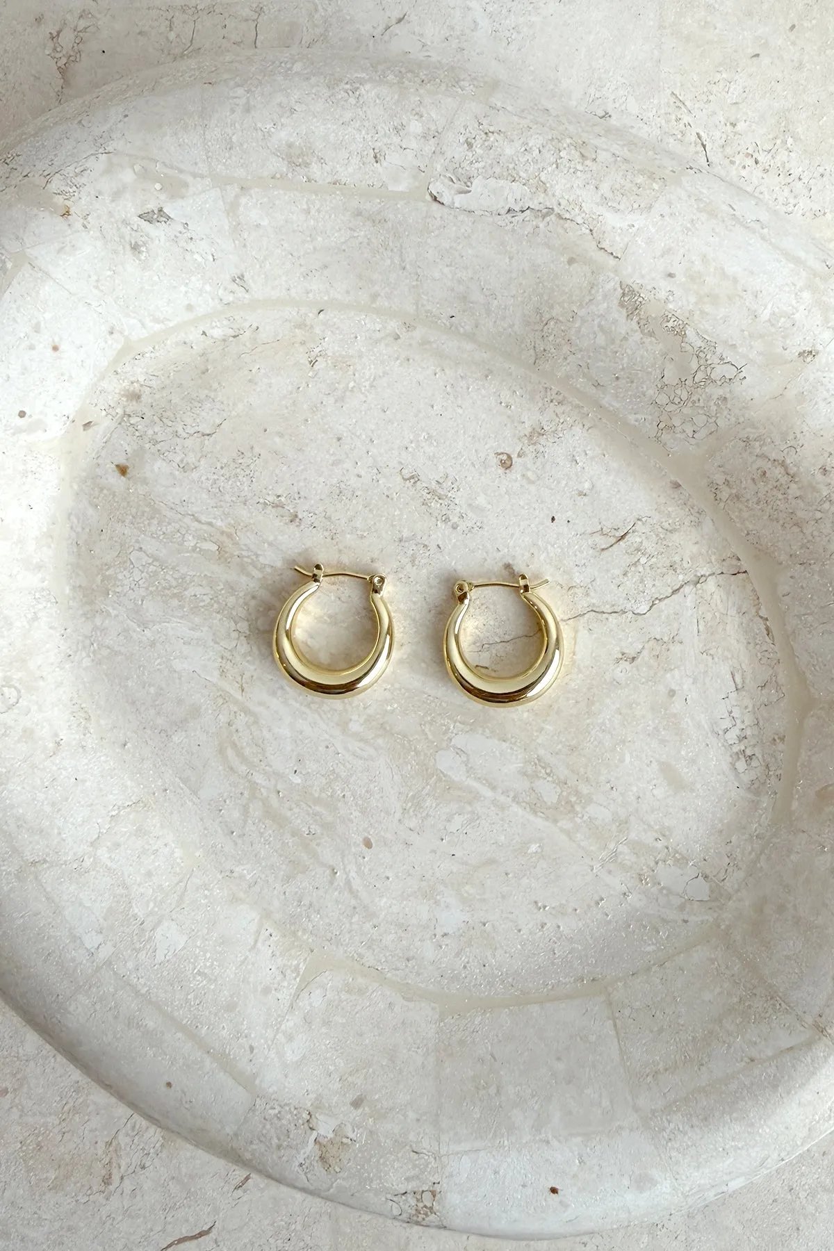 Mini Gold Huggie Hoops sold by UNE PIECE