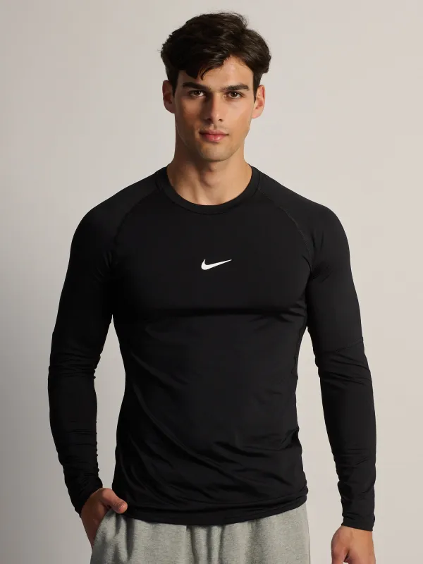 NIKE DRI-FIT LONG SLEEVE FITNESS TOP -  BLACK made by Nike