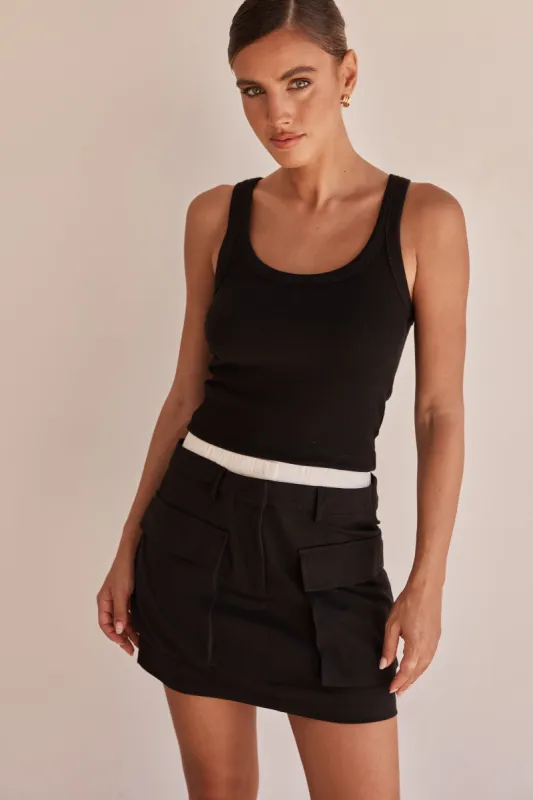 Verity Mini Skirt (Black) sold by Runway Scout