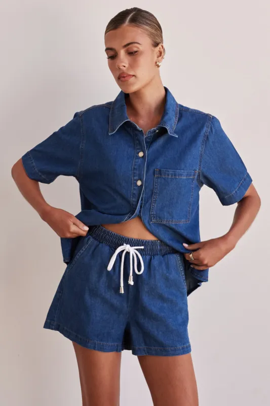 Baylee Denim Shorts (Blue) sold by Runway Scout