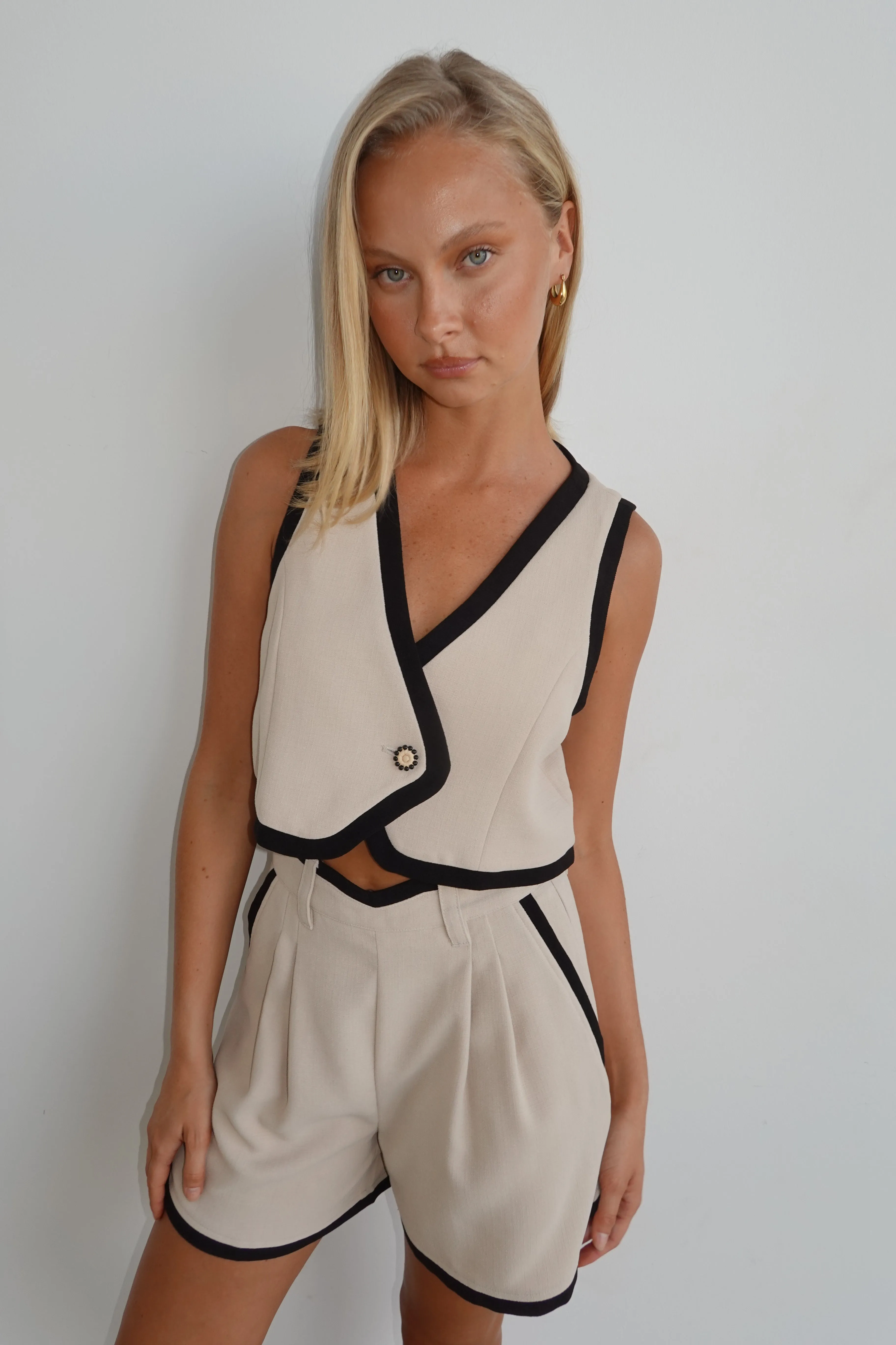 Hailey Vest (Beige) sold by Runway Scout