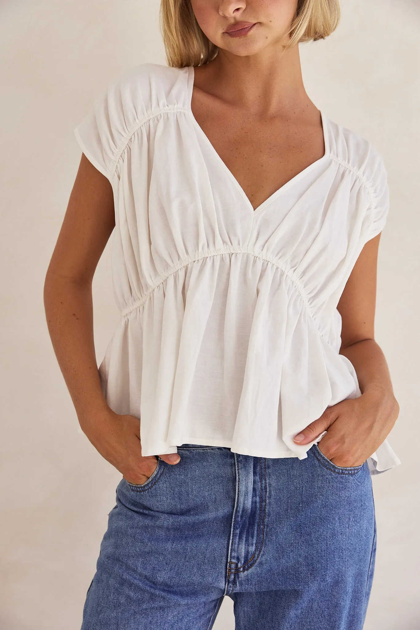 Benita Top (White) sold by Runway Scout