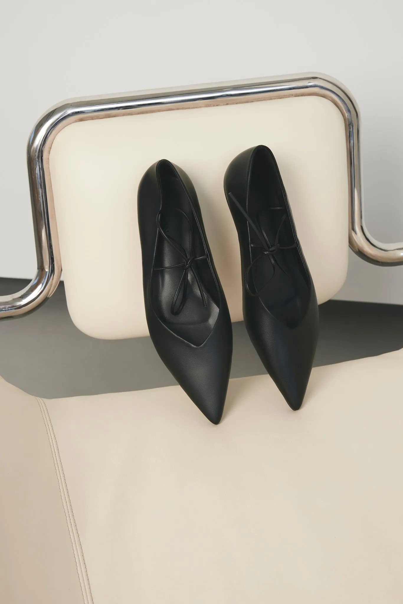 Haruna Flat (Black) sold by Runway Scout