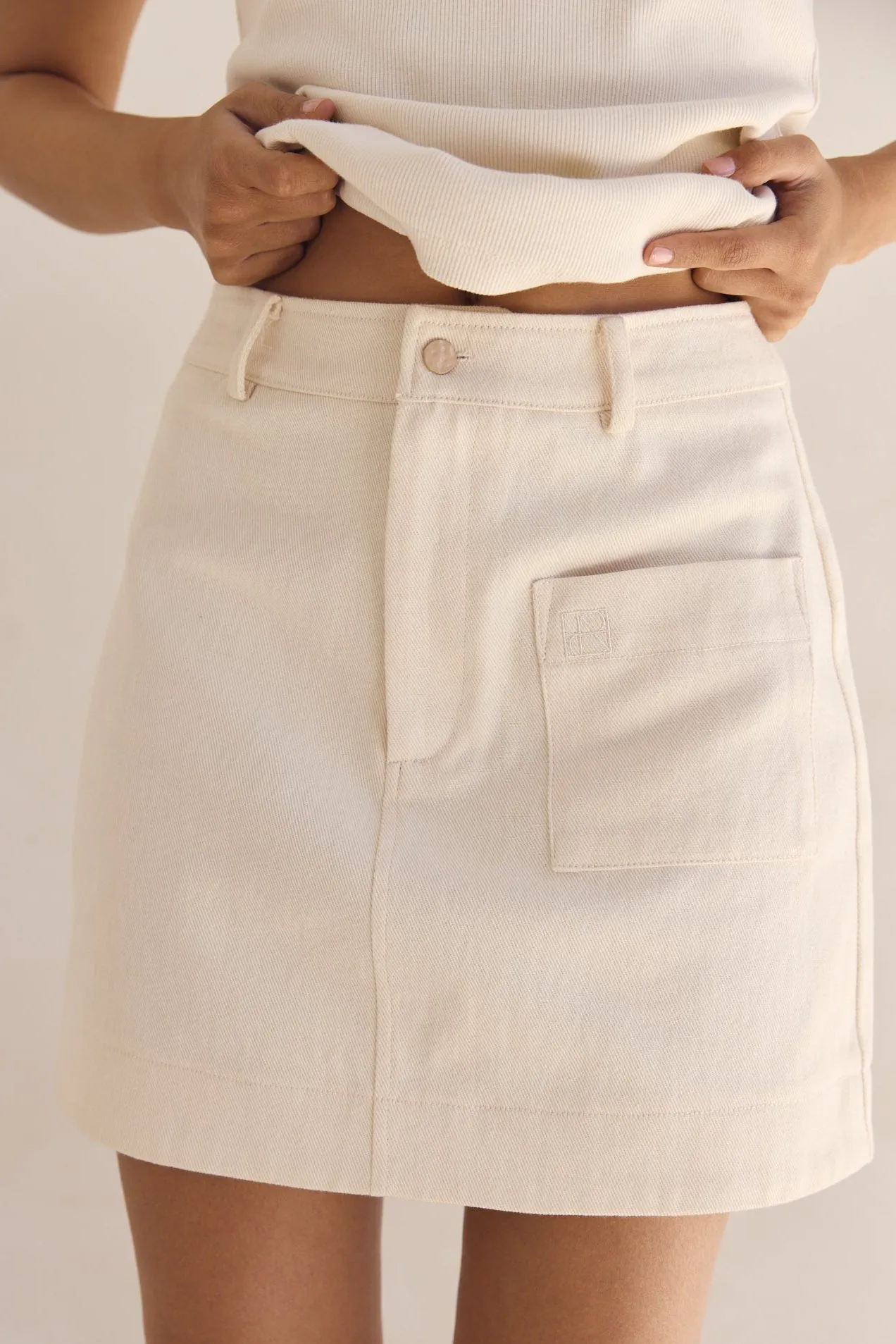 Dakoda Denim Mini Skirt (Cream) sold by Runway Scout