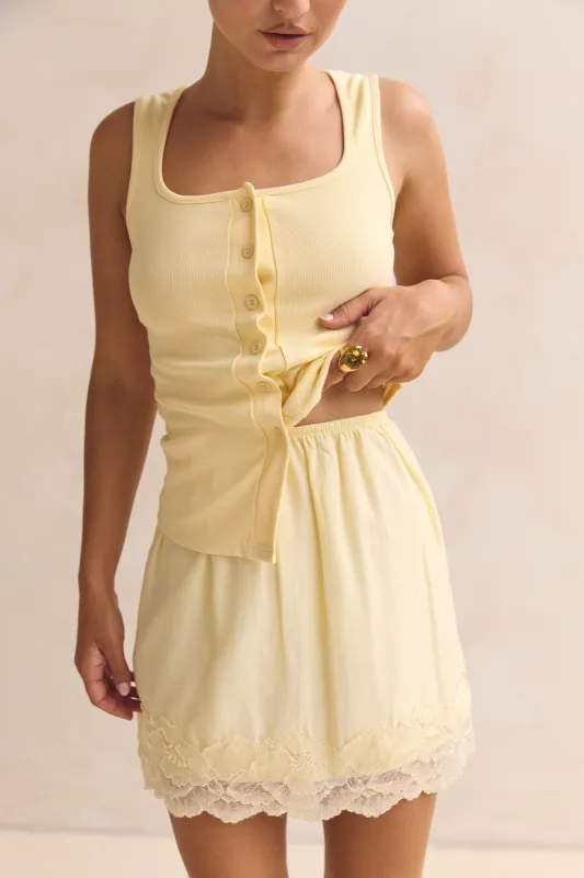 Leia Lace Mini Skirt (Yellow) sold by Runway Scout