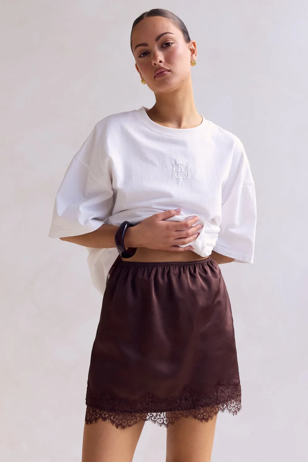 Aster Lace Mini Skirt (Chocolate) sold by Runway Scout