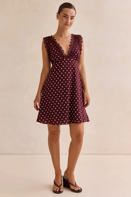 Emaretta Polka Mini Dress (Plum) sold by Runway Scout