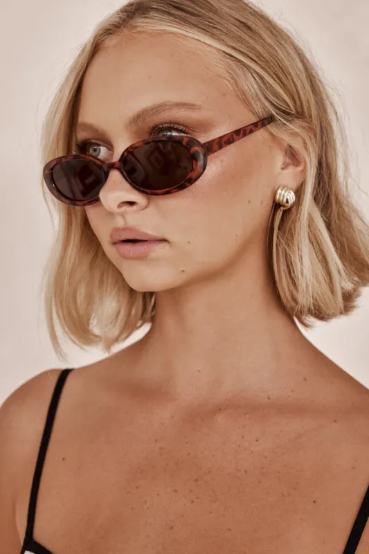 Tia Sunglasses (Brown) sold by Runway Scout