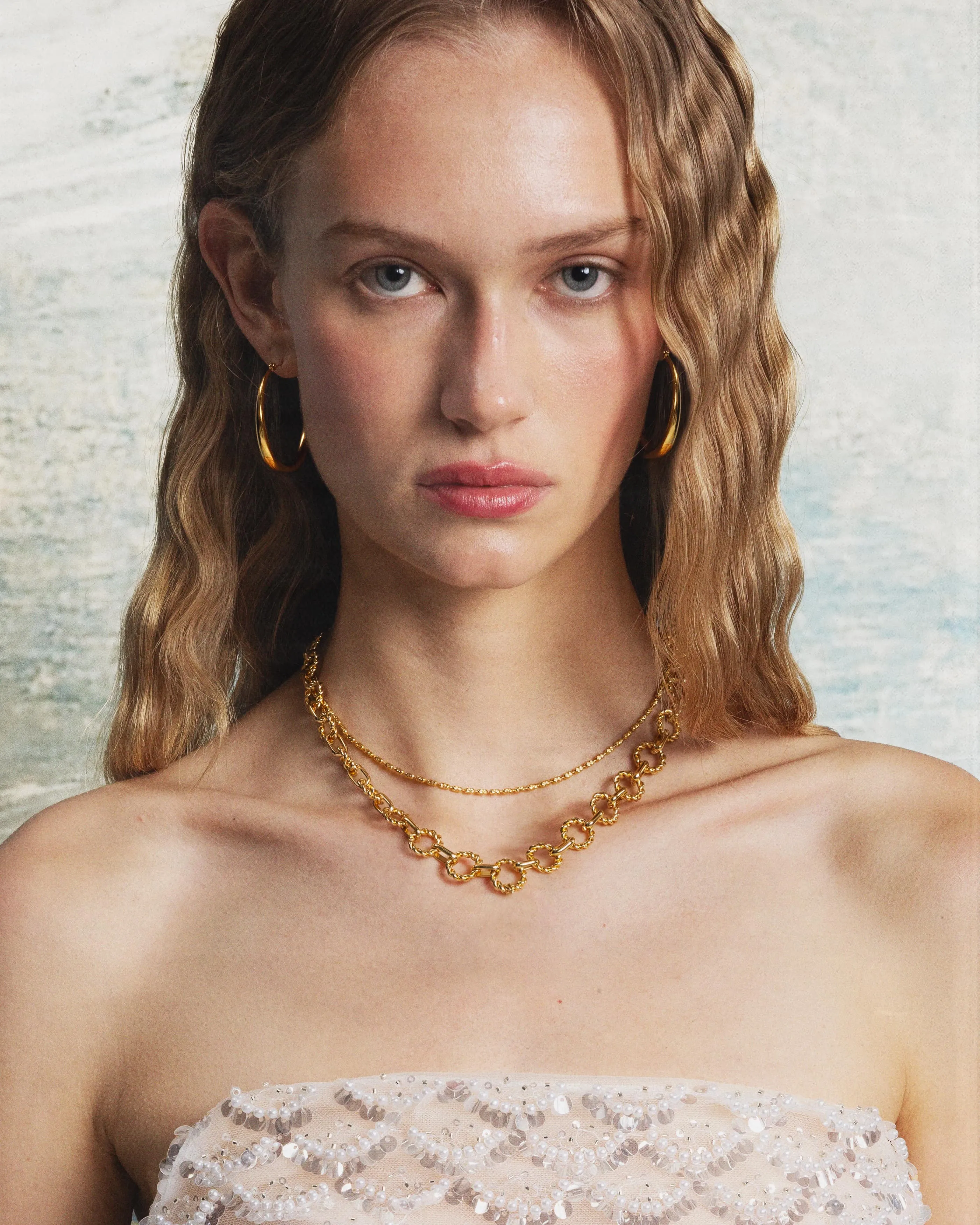 Sloane Hoop Earrings in Gold sold by en route product image thumbnail 2