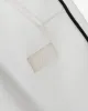 Street Thing (white) sold by Karl Kani