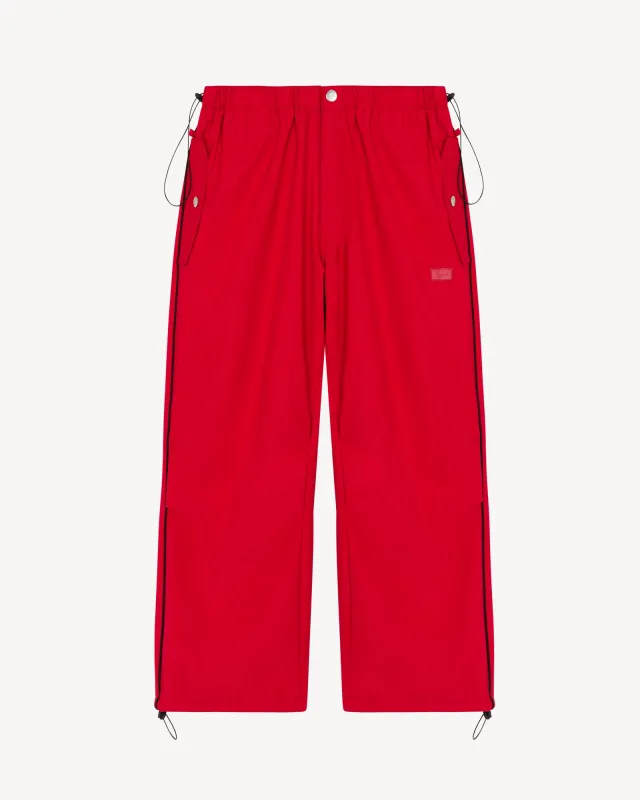 Street Thing Women's Joggers (red) sold by Karl Kani