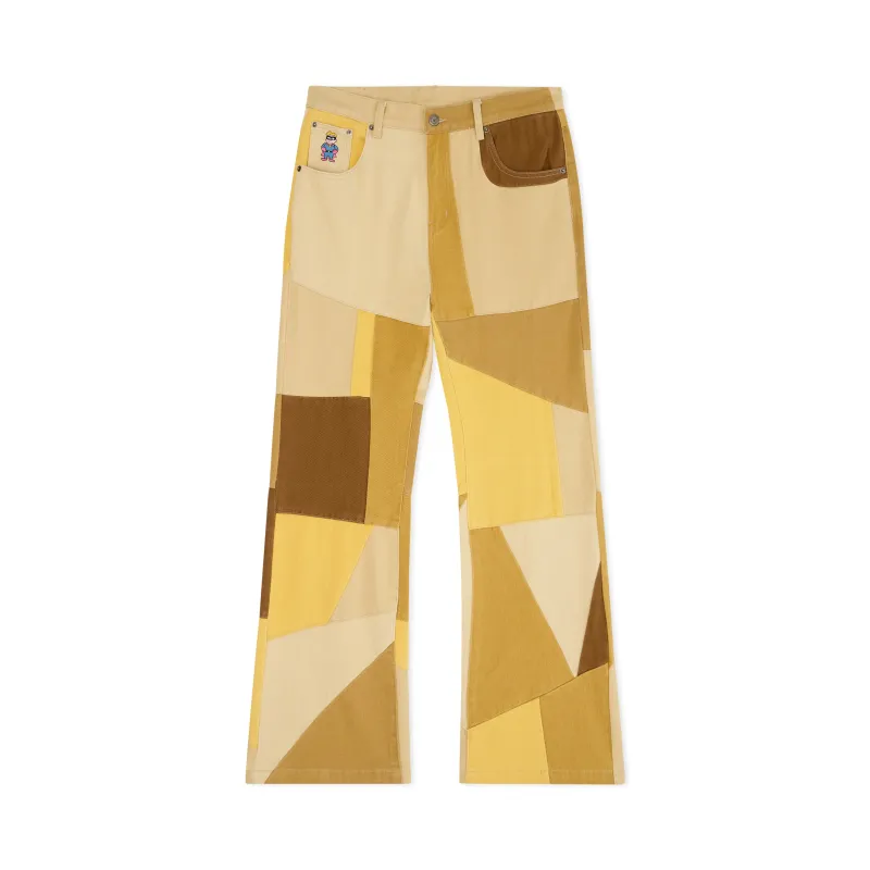 Geometric Patchwork Flare Pants [Yellow] sold by KidSuper Studios