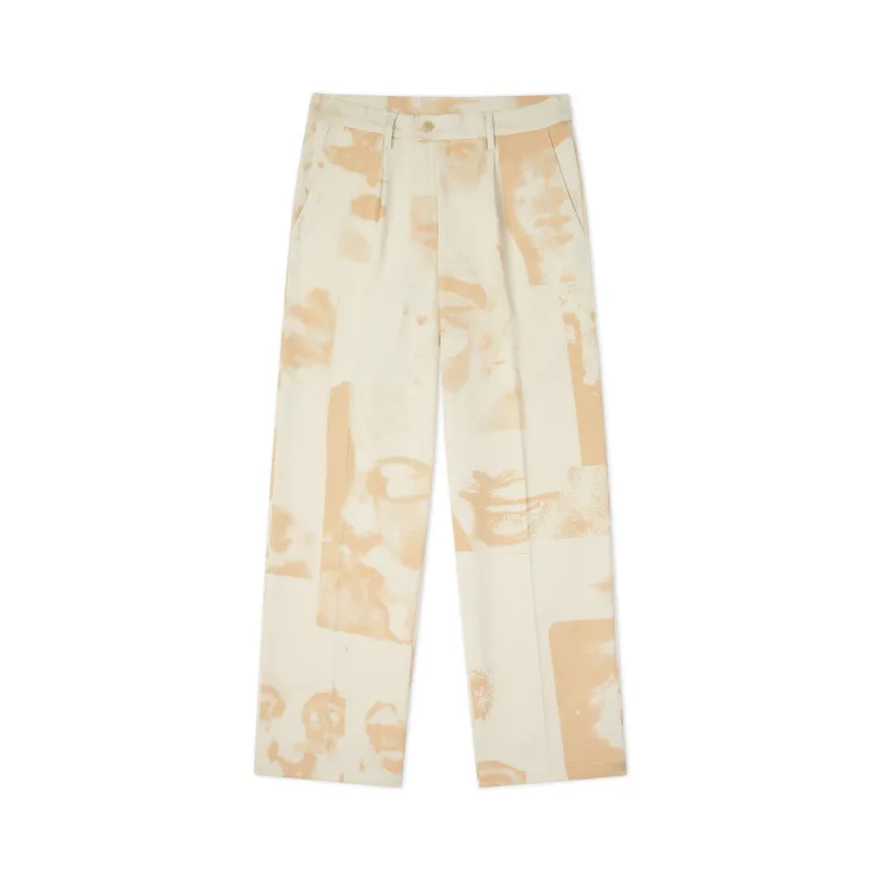 Faces Collage Pleated Trouser [Cream] sold by KidSuper Studios