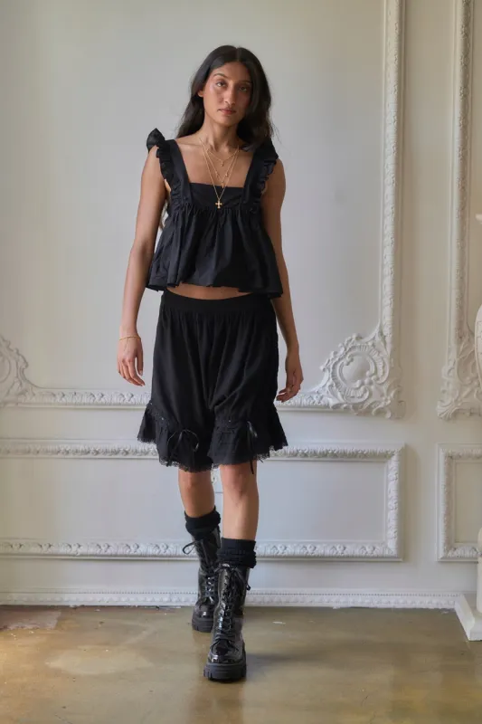 The Caviar Ruffle Apron Top sold by Selkie