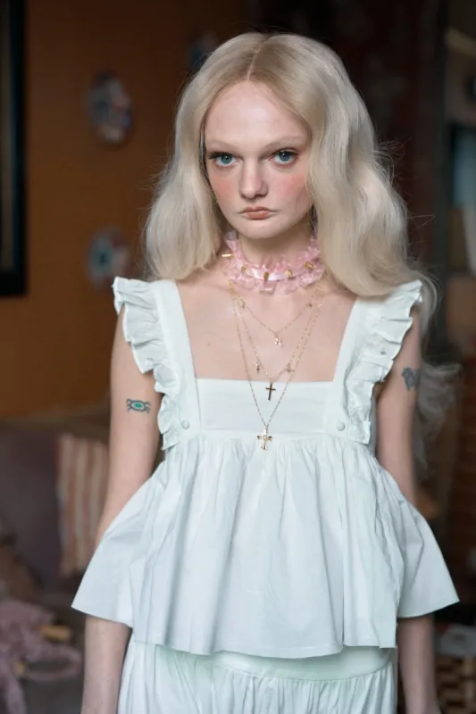 The Ivory Ruffle Apron Top sold by Selkie